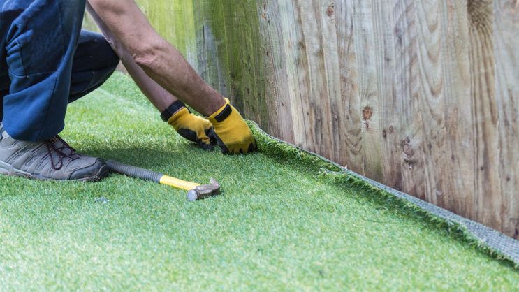 Artificial grass being installed by one of our expert staff